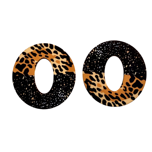 Pair of earrings with leopard print and black speckled design.