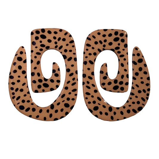 Pair of spiral-shaped earrings with a cheetah print pattern.