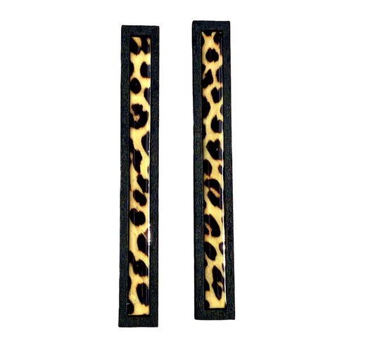 Pair of long rectangular earrings with leopard print design.